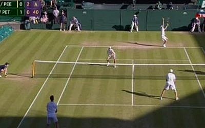 Yoni Erlich, at the net on the far side of the court, during the Wimbledon men’s doubles semi-final on July 9, 2015 (Channel 5 screenshot)