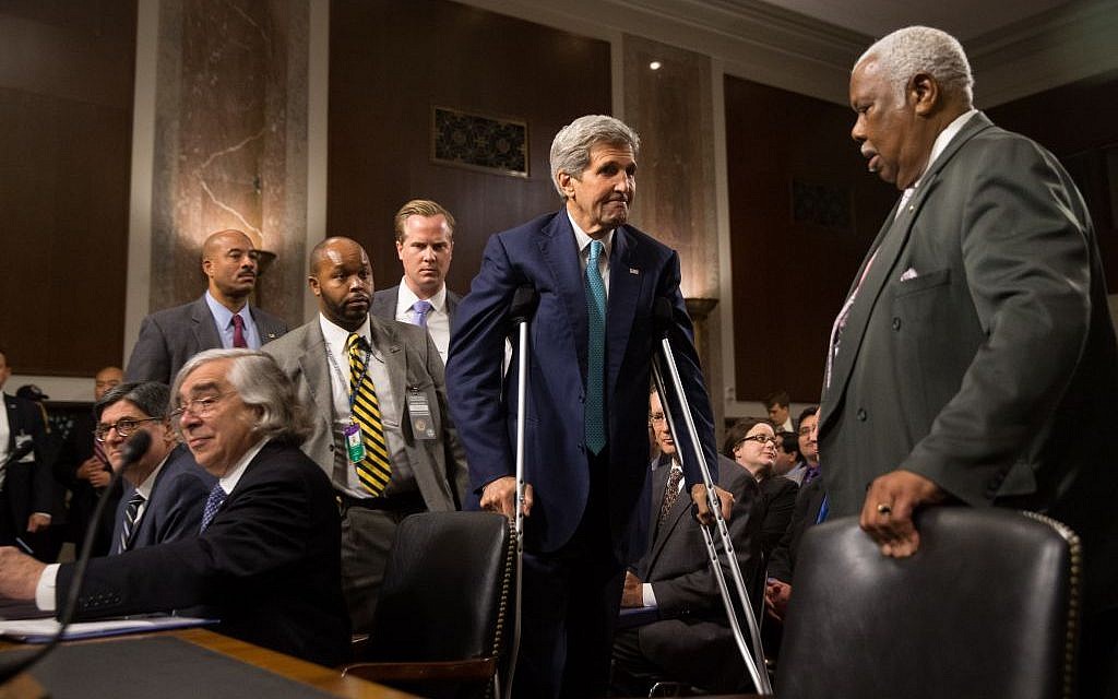 Secretary of State John Kerry, center, Secretary of Energy Ernest Moniz, seated second from left, and Secretary of Treasury Jack Lew, seated left, arrive to testify at a Senate Foreign Relations Committee hearing on Capitol Hill, in Washington, Thursday, July 23, 2015, to review the Iran nuclear agreement. (AP Photo/Andrew Harnik)