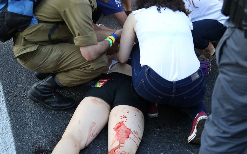 An injured woman after a stabbing at the annual Jerusalem Pride Parade on July 30, 2015. (Eric Cortellessa/Times of Israel)