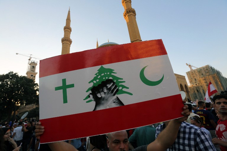 Tens of thousands march in Beirut 'You Stink' protest against ...