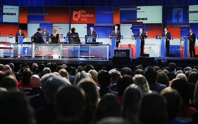 Guests watch Republican presidential candidates speak during the first Republican presidential debate hosted by Fox News and Facebook in Cleveland, Ohio, on August 6, 2015. (Scott Olson/Getty Images/AFP)
