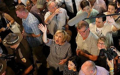 Democratic presidential candidate Hillary Clinton  (center) waves to fairgoers while campaigning at the Iowa State Fair on August 15, 2015 in Des Moines, Iowa. (Win McNamee/Getty Images/AFP)