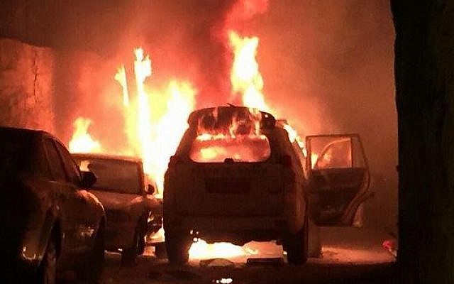 Illustrative: A Border Police car on fire after Palestinians threw a Molotov cocktail at the vehicle, in Jerusalem on Wednesday, August 26, 2015. (Screen capture)