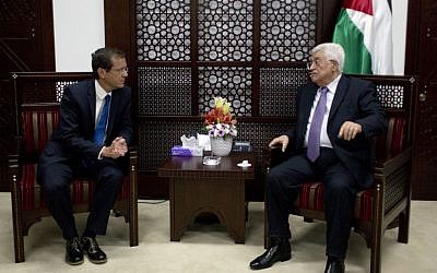 Palestinian Authority President Mahmoud Abbas, right, meets with then-Zionist Union leader Isaac Herzog in Ramallah on August 18, 2015. (AP Photo/Nasser Nasser/File)