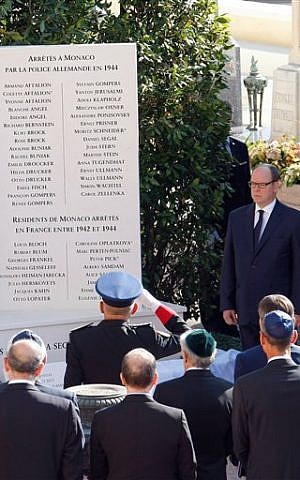 Prince Albert II, right, pays his respects after unveiling a monument to Jews deported from the Riviera principality during World War II on Thursday, Aug. 27, 2015. (Claude Paris/AP)