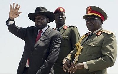 South Sudan's President Salva Kiir, left, accompanied by army chief of staff Paul Malong Awan, right, in the capital Juba, South Sudan, Thursday, July 9, 2015. (Jason Patinkin/AP)