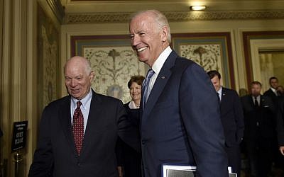 In this July 16, 2015, file photo, Vice President Joe Biden, right, walks with Sen. Ben Cardin, D-Md., left, after arriving for a meeting with Democrats on Capitol Hill in Washington. Determined to secure support for the Iran nuclear deal, President Barack Obama is making inroads with a tough constituency-- his fellow Democrats in Congress. (AP Photo/Susan Walsh, File)