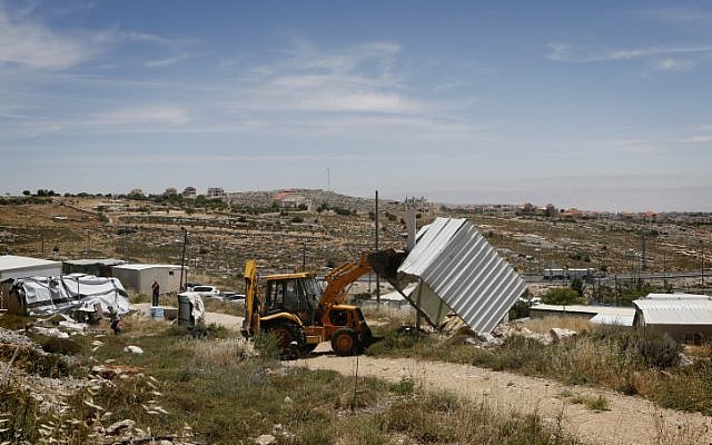 Illustrative photo of Israeli security forces demolishing an illegally built structure in a West Bank outpost (Miriam Alster/Flash 90)
