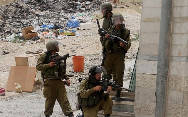 Illustrative photo of IDF soldiers during a protest at the Qalandiya checkpoint near the West Bank city of Ramallah on June 5, 2014. (Issam Rimawi/Flash90)
