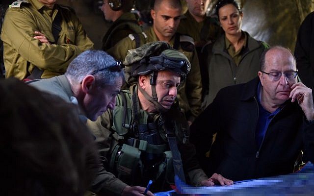 Defense Minister Moshe Ya'alon seen with Colonel Asher Ben-Lulu, commander of the IDF's Kfir infantry brigade, during an army exercise in the Golan Heights on April 02, 2015. (Ariel Hermoni/Ministry of Defense)