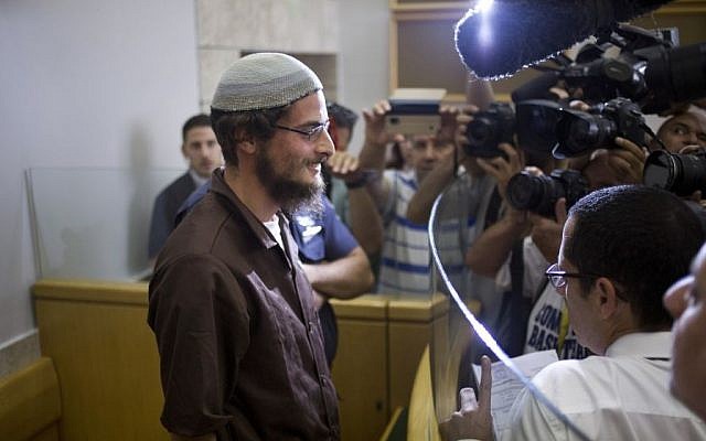 The alleged head of a Jewish extremist group, Meir Ettinger, appears in court in Upper Nazareth, Tuesday, Aug. 4, 2015. (AP Photo/Ariel Schalit)