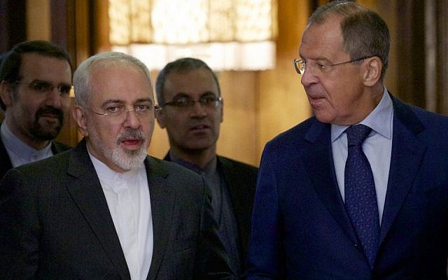 Iranian Foreign Minister Mohammad Javad Zarif, left, chats with Russian Foreign Minister Sergey Lavrov upon being welcomed by Lavrov for their meeting in Moscow, Russia, on August 17, 2015. (AP/Ivan Sekretarev)