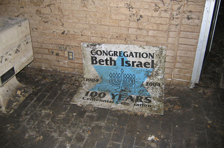 After Hurricane Katrina, this was what was left of Congregation Beth Israel’s centennial celebration sign. (Adam Magnus)