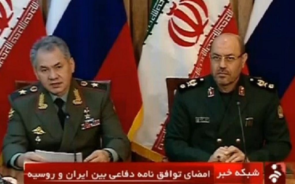 Iranian Defense Minister Hassan Dehghan, right, and his Russian counterpart Sergei Shoigu attend a press conference in Tehran in January 2015. (screen capture: AFP)