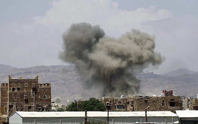 Illustrative image of smoke billowing from buildings after reported air strikes by the Saudi-led coalition on arms warehouses at Al-Dailami air base, on September 29, 2015, north of the Yemeni capital Sanaa. (AFP/Mohammed Huwais)