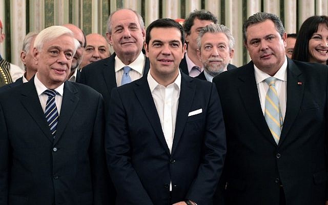 Greek Prime Minister Alexis Tsipras (C) poses with Defense Minister Panos Kammenos of the Independent Greeks (R) and Greek President Prokopis Pavlopoulos (L) after the swearing-in ceremony of the new government at the presidential palace in Athens on September 23, 2015. (Photo: AFP Photo / Louisa Gouliamaki)