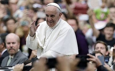 Pope Francis acknowledges faithful as he parades on his way to celebrate Mass Sunday, Sept. 27, 2015, in Philadelphia. (AP Photo/Matt Rourke, Pool)