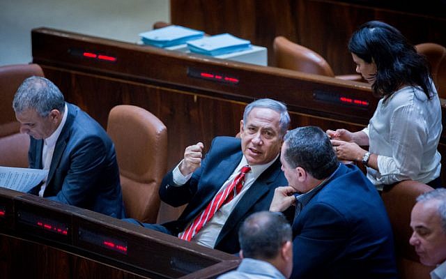 Prime Minister Benjamin Netanyahu speaks to Justice Minister Ayelet Shaked and Transportation Minister Yisrael Katz at the Knesset on September 2, 2015. (Yonatan Sindel/Flash90)