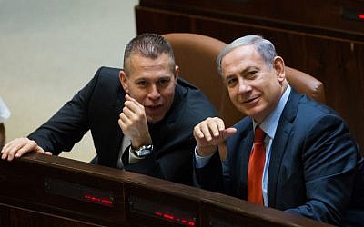 Prime Minister Benjamin Netanyahu (right) speaks with Public Security Minister Gilad Erdan (left) in the Israeli Knesset in Jerusalem on September 7, 2015. (Yonatan Sindel/Flash90)