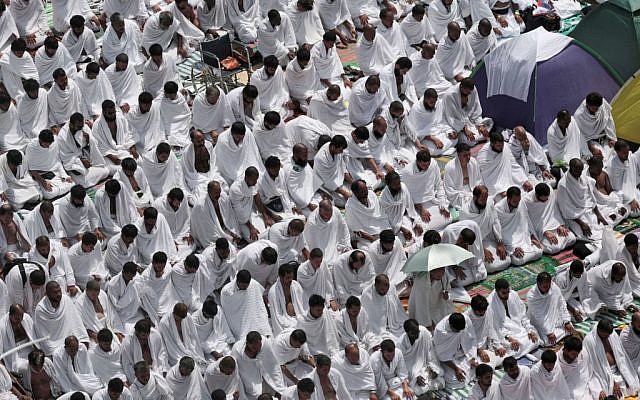Muslim pilgrims pray outside Namira mosque in Arafat, on the second and most significant day of the annual hajj pilgrimage, near the holy city of Mecca, Saudi Arabia, Wednesday, September 23, 2015. (AP/Mosa'ab Elshamy)