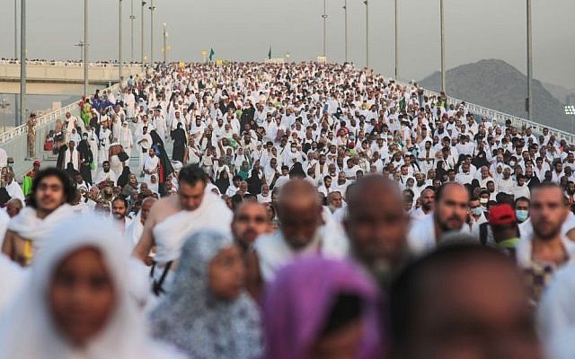 Hundreds of thousands of Muslim pilgrims make their way to cast stones at a pillar symbolizing the stoning of Satan, in a ritual called "Jamarat," the last rite of the annual hajj, on the first day of Eid al-Adha, in Mina near the holy city of Mecca, Saudi Arabia, Sept. 24, 2015. (AP/Mosa'ab Elshamy)