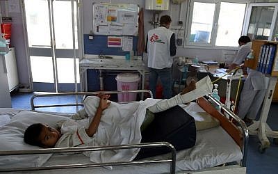 In this file photograph from May 21, 2015, an Afghan child receives treatment at the Medecins Sans Frontieres (MSF), or Doctors Without Borders, hospital in the northern city of Kunduz, after being wounded in a fight between the Taliban and Afghan security forces. (AFP PHOTO/SHAH Marai/FILES)