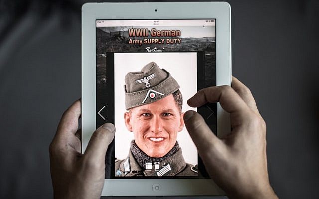 Illustrative photo of a man browsing the website of DiD, a company that produced a Nazi-uniform-clad figurine with a face similar to Bastian Schweinsteiger, in Hong Kong on October 23, 2015. (AFP/Philippe Lopez)