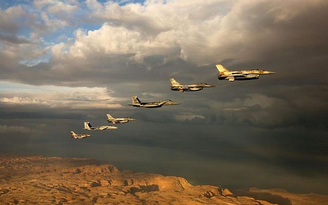 Israeli and foreign fighter jets fly in formation through cloudy skies over the Negev desert during the 'Blue Flag' exercise at Ovda Airfield near Eilat on October 27, 2015. (Israeli Air Force)