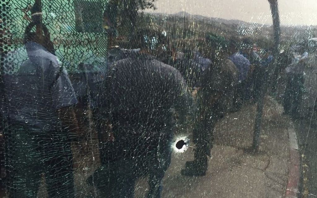 The windshield of a bus with a bullet hole, at the scene of a terror attack in the Jerusalem neighborhood of Armon Hanatziv, on Tuesday, October 13 2015. (Magen David Adom)