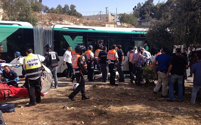 Police and emergency medical services treat the victims of a terror attack in the Armon Hanatziv neighborhood in Jerusalem on Oct. 13, 2015. (Israel Police)