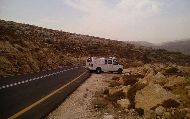 An ambulance is seen on a road in the West Bank where a man was stabbed by a Palestinian terrorist on Sunday, October 25, 2015. (Magen David Adom)