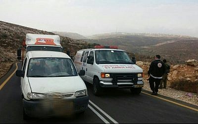 An ambulance is seen on a road in the West Bank where a man was stabbed by a Palestinian terrorist on Sunday, October 25, 2015. (Magen David Adom) 