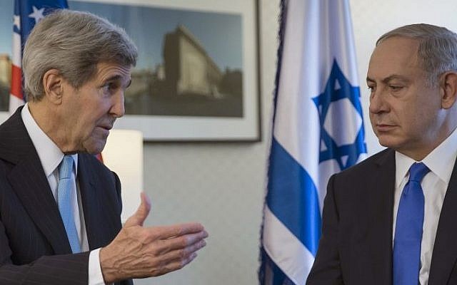 US Secretary of State John Kerry, left, speaks with Prime Minister Benjamin Netanyahu during a meeting in Berlin, Germany, Thursday, October 22, 2015. (Carlo Allegri/Pool Photo via AP)
