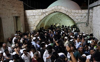 Hundreds of ultra Orthodox Jewish men pray near the compound of Joseph's Tomb in the West Bank city of Nablus early on June 10, 2013. (Yaakov Naumi/Flash90) 