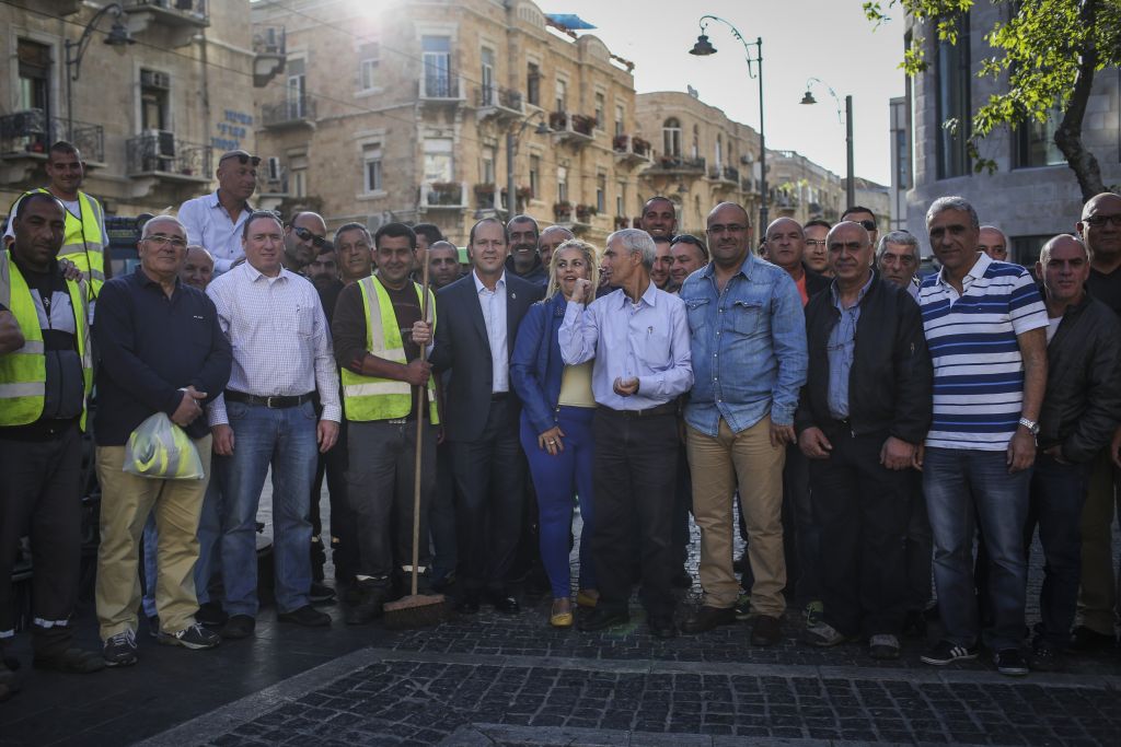 Mayor Nir Barkat and a crew of Jerusalem sanitation workers in April 2014; the municipality does not have any data about the number of Arabs working in custodial positions in the city, said a city spokesperson (Hadas Parush/Flash 90)