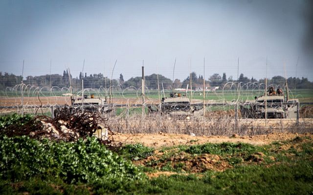 Illustrative: Israeli forces next to the security fence on the border between Israel and southern Gaza Strip. (Abed Rahim Khatib/Flash90)