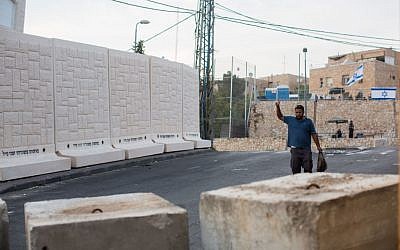 Five of the six concrete slabs placed between Jerusalem's (Jewish) East Talpiot and (Arab) Jabel Mukaber neighborhoods, October 18, 2015 In the foreground, concrete blocks at the entrance to Jabel Mukaber. (Photo by Yonatan Sindel/Flash90)