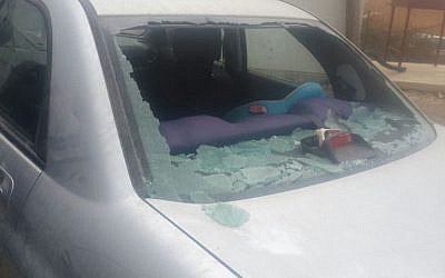 The smashed window of an Israeli vehicle after an attack by rock throwing Palestinians near the West Bank settlement of Tekoa, October 7, 2015. (Courtesy)