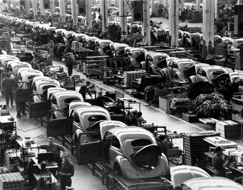  In this June 16, 1954 file photo, VW Beetles are assembled at the Volkwagen auto works plant, in Wolfsburg, West Germany. (AP Photo/Reithausen, File)