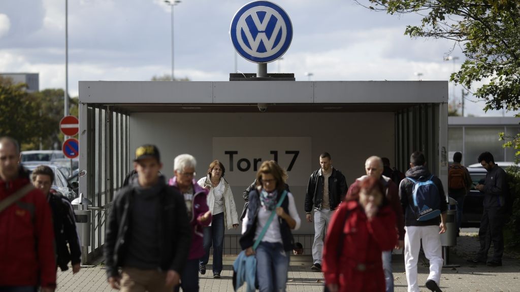 People leave the Volkswagen factory at Gate 17 in Wolfsburg, Germany. (AP Photo/Markus Schreiber)