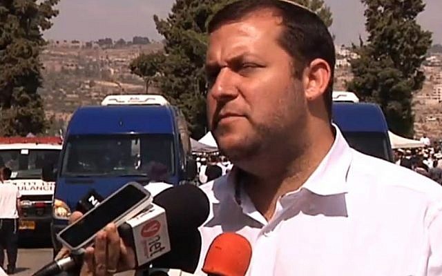 Samaria Regional Council head Yossi Dagan speaks to the media after the funeral of Eitam and Naama Henkin on Friday, October 2, 2015. (Screen capture Channel 2)