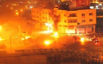 Screenshot from the fire started by Palestinian rioters at Joseph's Tomb in Nablus, in the West Bank, on October 16, 2015. 