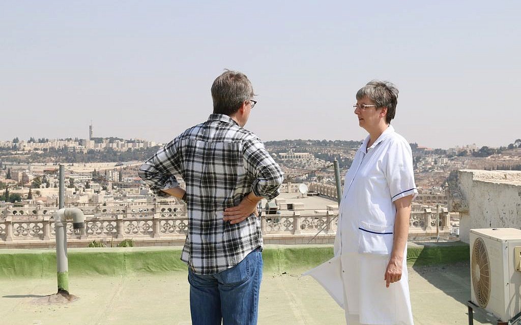 Sister Monika and a visitor on the rooftop of Le Hȏpital Saint-Louis (Shmuel Bar-Am)