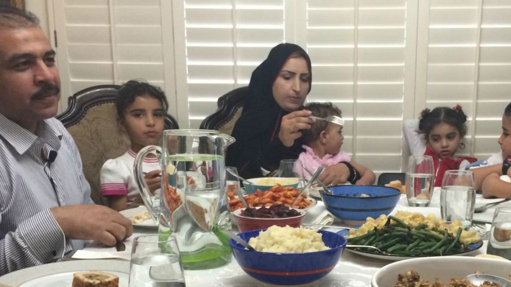 Syrian refugee family newly arrived to Phoenix, Arizona enjoy their first American Thanksgiving dinner at the home of human rights activist Rabbi Shmuly Yanklowitz, November, 26, 2015. (Courtesy)