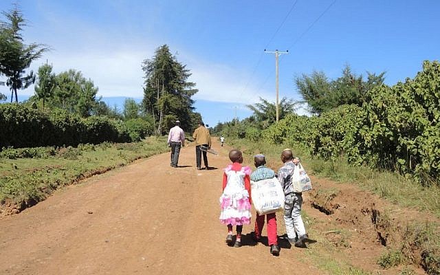 Walking to synagogue in the tiny village of Gathundia, near Kasuku. Gathundia is located on the highlands of Kenya, near the equator. (Melanie Lidman/Times of Israel)