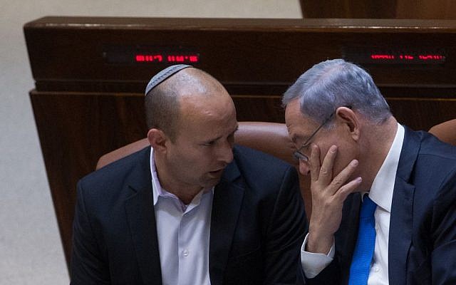 Prime Minister Benjamin Netanyahu, right, with Education Minister Naftali Bennett in the Knesset, June 17, 2015. (Miriam Alster/Flash90)