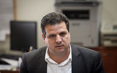 Leader of the Joint Arab list Ayman Odeh leads the weekly Joint Arab list meeting at the Knesset, Israel's parliament in Jerusalem, October 12, 2015. (Miriam Alster/Flash90)