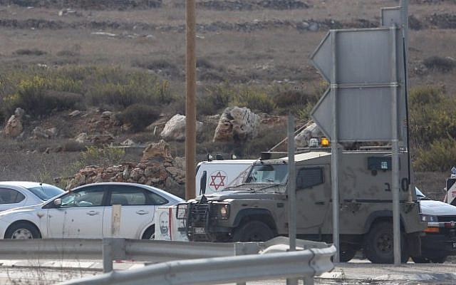File: Israeli medical personnel arrive at the scene of a stabbing attack at the Tapuah Junction near the West Bank city of Nablus, on October 30, 2015. (Flash90)