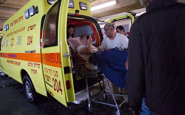 Paramedics wheel a wounded Israeli man into the emergency room of the Shaare Zedek Medical Center on November 6, 2015, Two Israelis were shot and injured on Friday in a Palestinian terror attack near the Tomb of the Patriarchs in the West Bank city of Hebron. (Photo by Yonatan Sindel/Flash90)