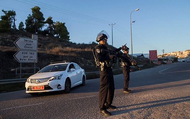 Illustrative: Israeli security police stand near the Otniel Junction in the southern West Bank on November 13, 2015. (Yonatan SIndel/Flash90)